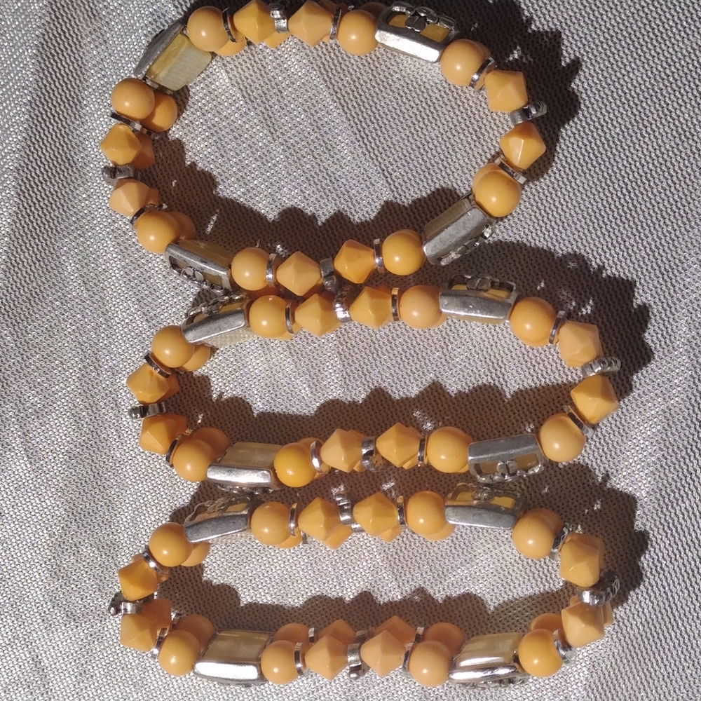 3 women orange beaded stretch bracelet